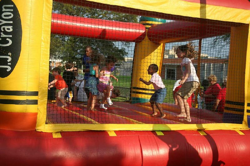 Bounce houses are a key part of the fun at Lamanpalooza, a “wholesome, family-friendly” celebration presented by the William F. Laman Public Library System. This year’s event will be at the newly reopened Argenta Branch.