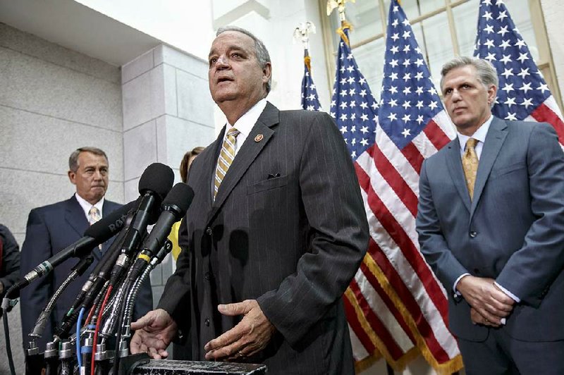 Rep. Jeff Miller, R-Fla., shown here speaking Tuesday on Capitol Hill, said Wednesday that the House was addressing “the biggest scandal in the history” of Veterans Affairs. Also shown is Speaker of the House John Boehner of Ohio, left, and incoming Majority Leader Rep. Kevin McCarthy, R-Calif., right.