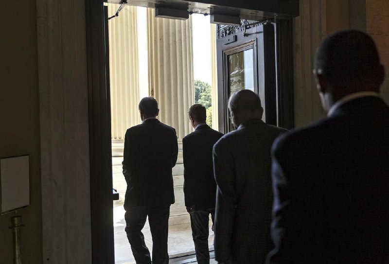 House members head for the door Thursday on Capitol Hill after discussion on a border measure. With a five-week recess beginning this weekend, some GOP leaders vowed to try again today.