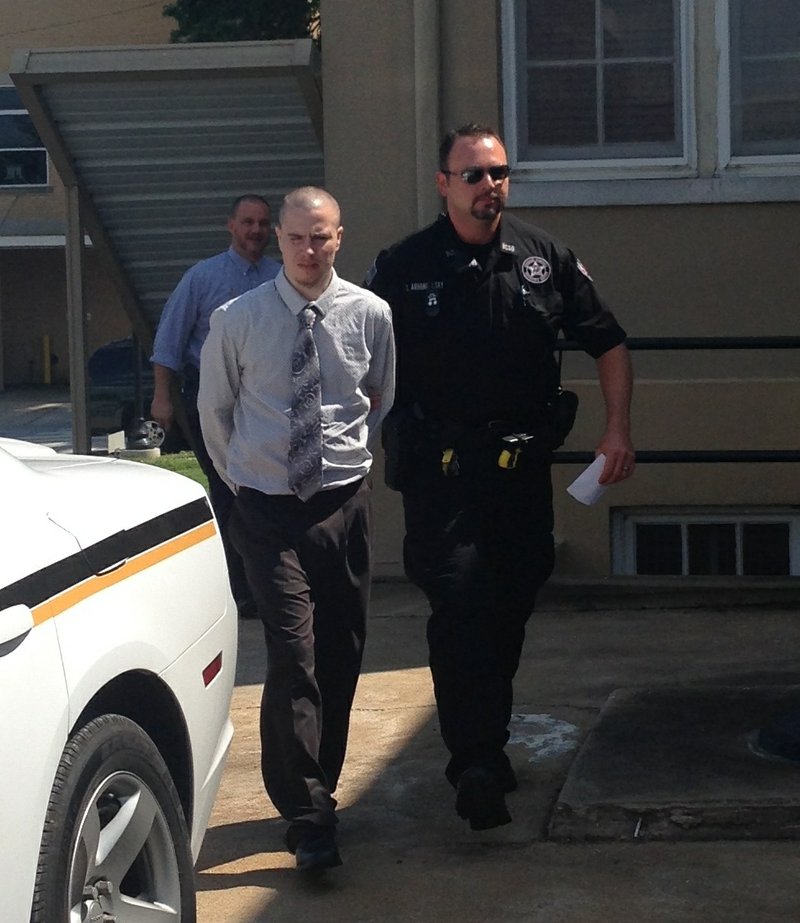Zachary Holly is escorted Friday, Aug. 1, 2014, from court after learning prosecutors will be able to use his confession as evidence during his capital murder trial at the Benton County Courthouse in Bentonville.