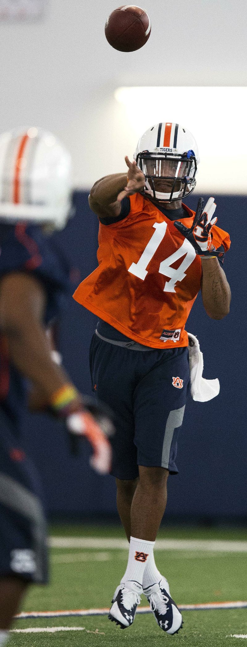 Auburn quarterback Nick Marshall (14) throws the ball during NCAA college football practice Friday, Aug. 1, 2014, in Auburn, Ala.
(AP Photo/Brynn Anderson)