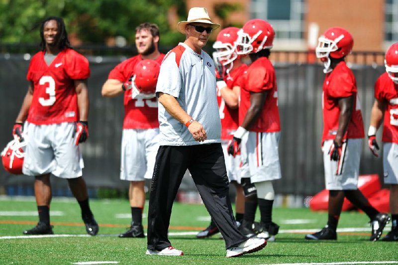 CORRECTS NAME OF PHOTOGRAPHER IN CAPTION - Georgia coach Mark Richt watches his players during NCAA college football practice Friday, Aug. 1, 2014, in Athens, Ga. (AP Photo/Athens Banner-Herald, AJ Reynolds)