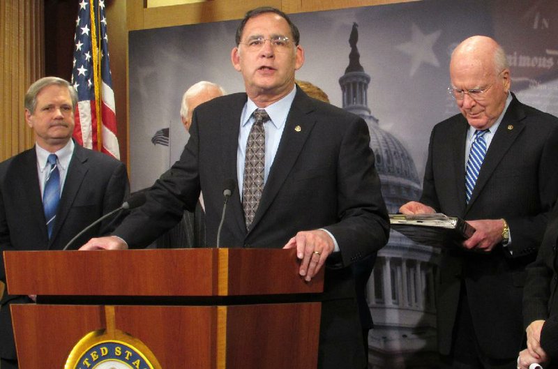 Arkansas Democrat-Gazette/SARAH D. WIRE - 02/04/2014 - U.S. Sen. John Boozman speaks to the media after the Senate approves the farm bill 68-32. The Rogers Republican was a member of the committee that negotiated the final bill.
