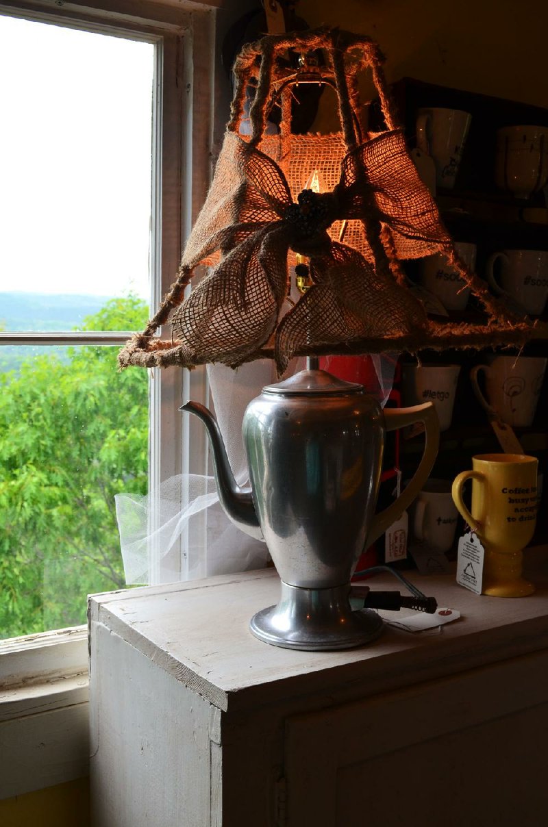 Nathania Sawyer photo/
Cheryl Thielemann makes useful items, such as this lamp, from other peoples castoffs.