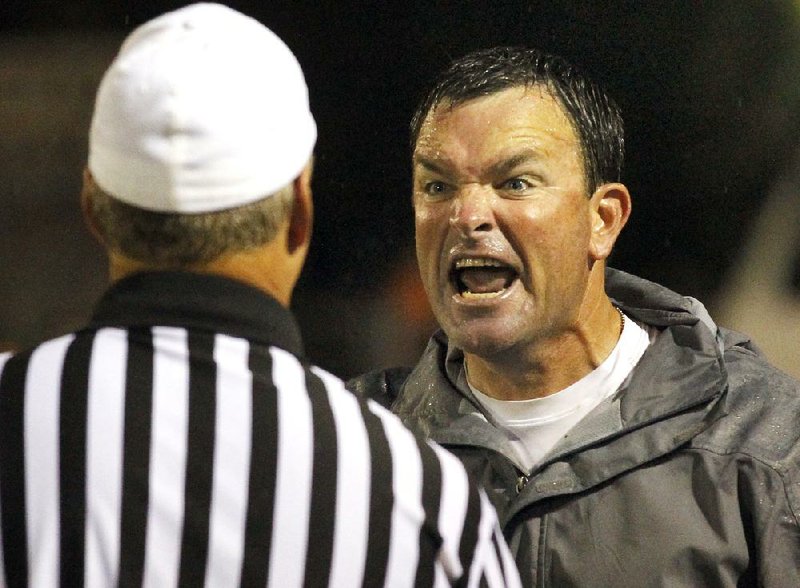 Arkansas Democrat-Gazette/ BENJAMIN KRAIN --9/14/12--
North Little Rock coach Brad Bolding argues with an official during a game against Pine Bluff, coached by his brother Bobby Bolding on Friday night. 
