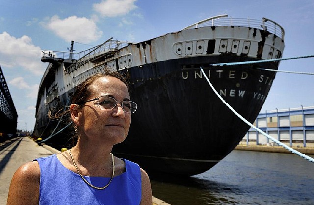Susan L. Gibbs with the SS United States in Philadelphia in early July. Gibbs, of Chevy Chase, Md., is the granddaughter of the ship's architect, famous ship designer, William Francis Gibbs. Illustrates SHIP (category a), by Michael E. Ruane (c) 2014, The Washington Post. Moved Wednesday, July 30, 2014. (MUST CREDIT: Washington Post photo by Michael S. Williamson)