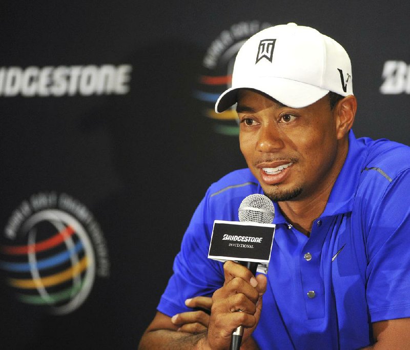 FILE - In this Aug. 1, 2012 file photo, Tiger Woods answers questions during a news conference at the Bridgestone Invitational golf tournament at Firestone Country Club in Akron, Ohio. Woods has eight wins at Firestone, one more than Matt Kuchar has won on the PGA Tour. In 15 appearances, he has made $11.06 million, which is roughly the same as Tom Watson has made in four decades on the PGA Tour. (AP Photo/Phil Long, File)