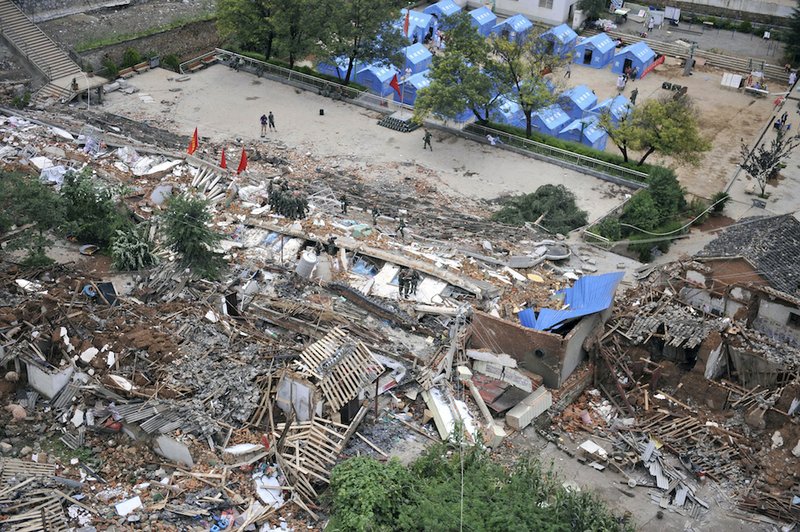 This photo released by China's Xinhua News Agency, shows the quake-hit Longtoushan Town of Ludian County in Zhaotong City, southwest China's Yunnan Province on Monday, Aug. 4, 2014. Rescuers dug through shattered homes Monday looking for survivors of the strong earthquake in southern China's Yunnan province that toppled thousands of homes on Sunday, killing hundreds and injuring more than a thousand people. 