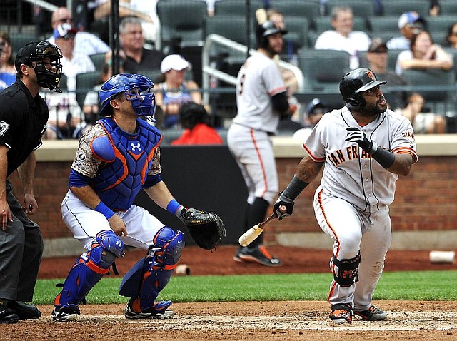 New York Mets catcher Travis d'Arnaud and San Francisco Giants third baseman Pablo Sandoval watch Sandoval's two-run double off of Mets starting pitcher Dillon Gee in the third inning of a baseball game at Citi Field on Monday, Aug. 4, 2014, in New York. (AP Photo/Kathy Kmonicek)