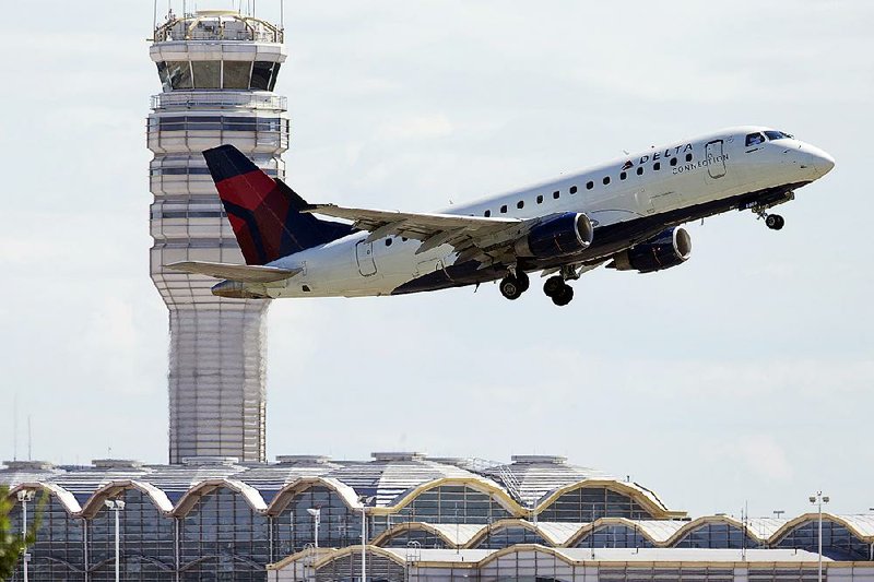 A Delta Air Lines jet takes off from Ronald Reagan Washington National Airport in Arlington, Va., Monday, July 28, 2014. In a victory for airlines and their workers' unions, the House rejected consumers' complaints and passed legislation letting airline advertising emphasize the base price of tickets, before taxes and fees are added. (AP Photo/Manuel Balce Ceneta)
