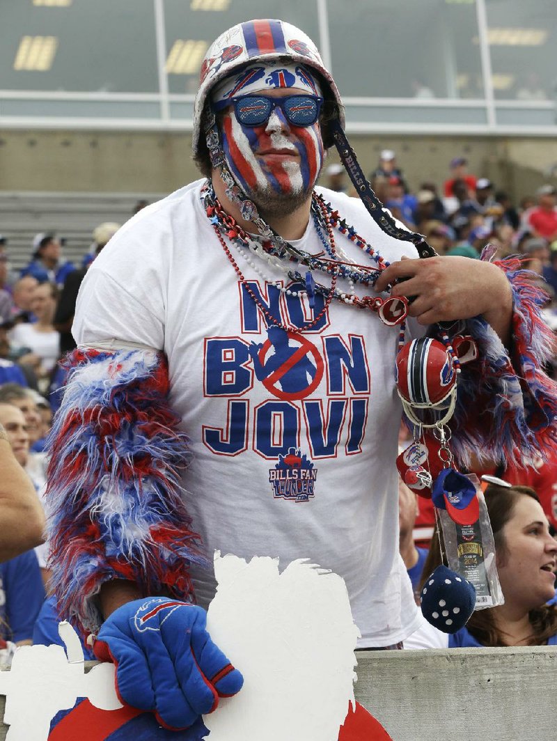 Buffalo Bills fan Jacob Gauda shows off his “No Bon Jovi” shirt during Pro Football Hall of Fame enshrinement ceremonies Saturday in Canton, Ohio. Gauda and most Bills fans don’t believe Jon Bon Jovi and a Toronto-based group will keep the NFL team in Buffalo.