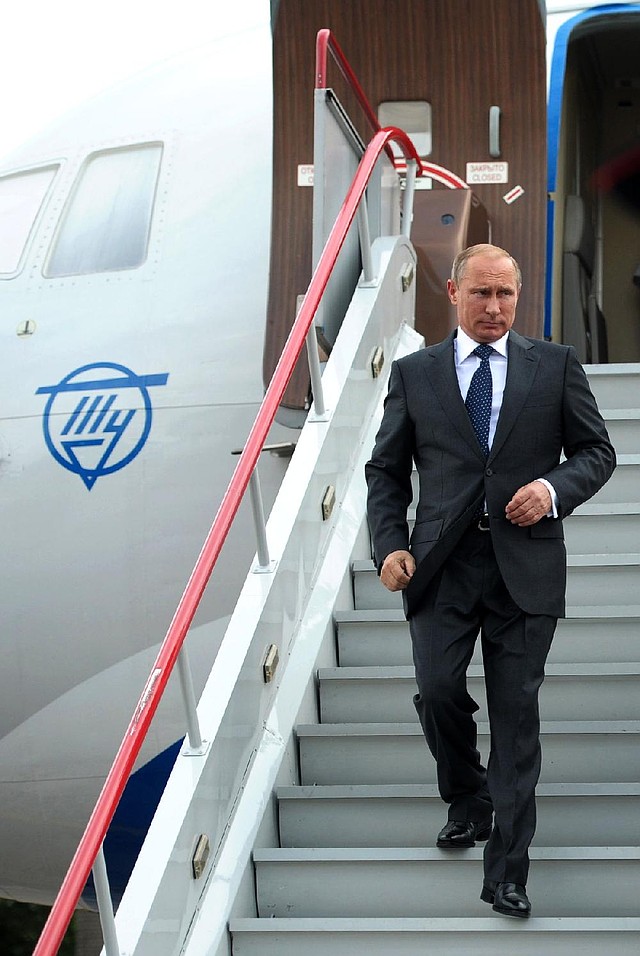 Russian President Vladimir Putin arrives in Voronezh, Russia, on Tuesday for a meeting with state officials. Putin said he has ordered the government to develop measures in response to Western sanctions.