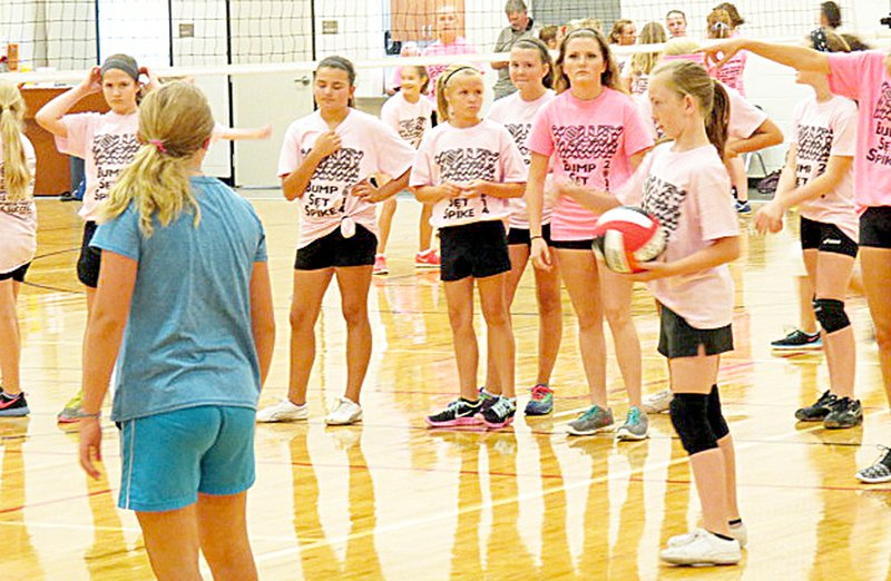 Photograh submitted Raven Cawthon started the sixth-graders out on their serving. Girls learned skills during first volleball camp at Pea Ridge Middle School last week.