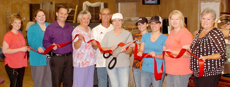 Photo by Randy Moll A ribbon cutting, sponsored by the Gentry Chamber of Commerce, was held at Pam&#8217;s Sugar Shack, located at 183 Rebecca St., Suite C, in Gentry, on July 30. Pictured are Siloam Springs Regional Hospital representatives Cathy Davis and Aimee Morrell, Gentry mayor Kevin Johnston, councilwoman Janice Arnold, owners Doug and Pam Tedford, employees Kaydi Ryan and Rebecca Miralez, chamber president Tammie Runyan and chamber executive director Bev Saunders. The new business offers breakfasts, lunches, baked goods and more and is open 5 a.m. to 5 p.m. Monday through Friday and 5 to 11 a.m. on Saturday. For more information, call 233-1606.