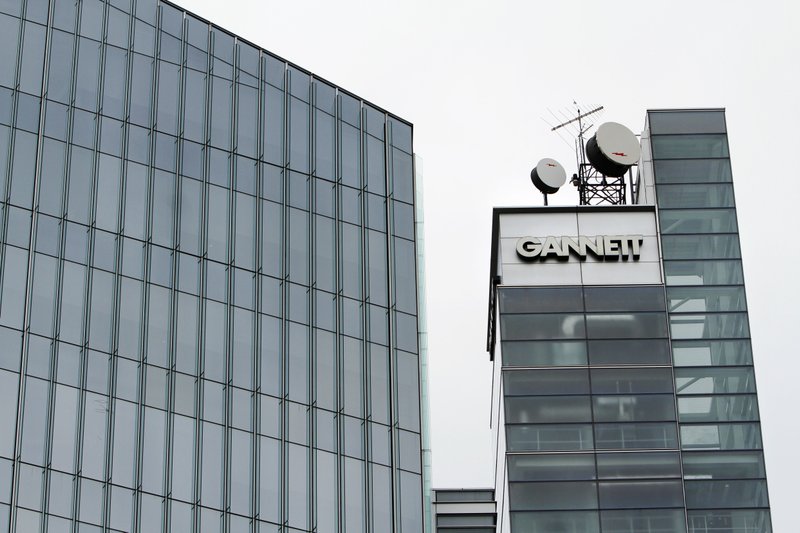 This July 14, 2010, file photo, shows Gannett headquarters in McLean, Va. Gannett is spinning off its publishing business from its broadcasting and digital operations. The company is also acquiring full ownership of Cars.com for $1.8 billion., the company announced Tuesday, Aug. 5, 2014.