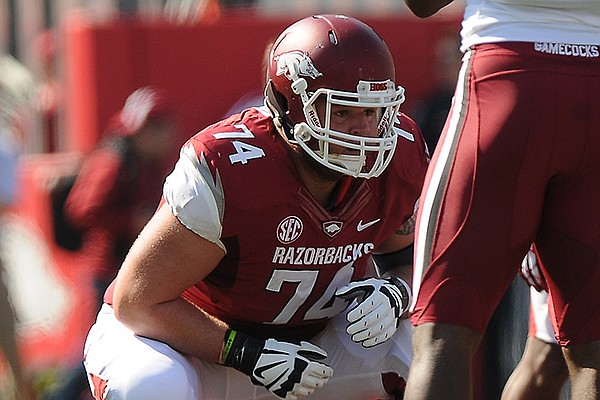 Arkansas' Brey Cook gets set on the line of scrimmage Saturday, Oct. 12, 2013, during the first quarter of the game against South Carolina at Donald W. Reynolds Razorback Stadium in Fayetteville.