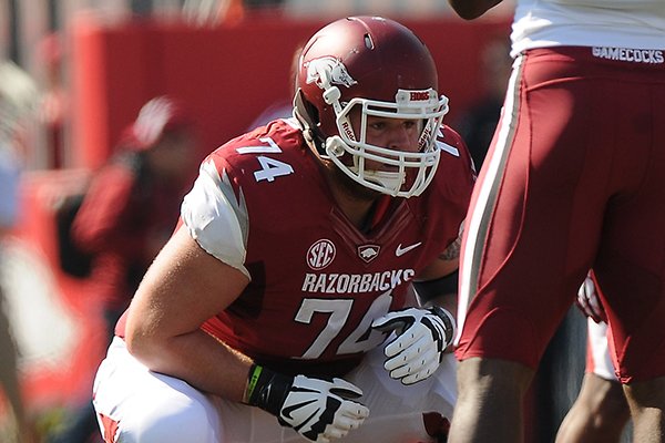 Arkansas' Brey Cook gets set on the line of scrimmage Saturday, Oct. 12, 2013, during the first quarter of the game against South Carolina at Donald W. Reynolds Razorback Stadium in Fayetteville.