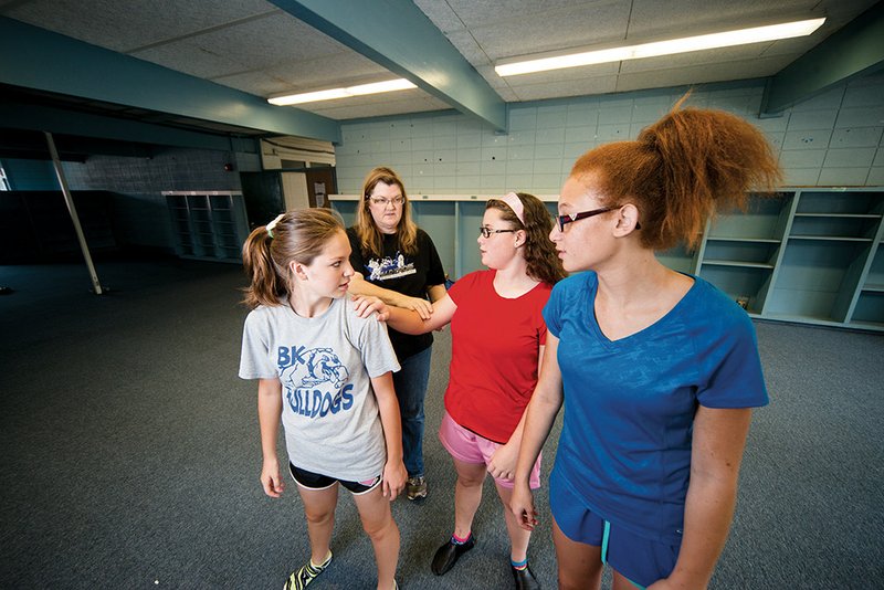 Above: LaDonna Gibson, artistic director of the Bald Knob Fine Arts Council, back, instructs Mattea Smithson, from left, Brooke Manley and Sarah Gibson during a dance class in Bald Knob.