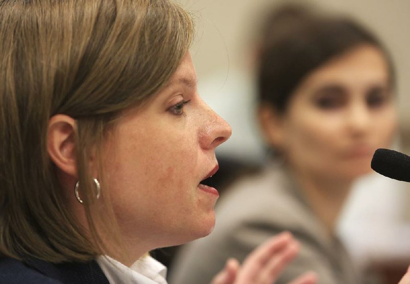 Mischa Martin (left) of the Office of Policy and Legal Services at the state Department of Human Services and Christin Harper, policy unit manager with the Children and Family Services Division, answer lawmakers’ questions Wednesday.


