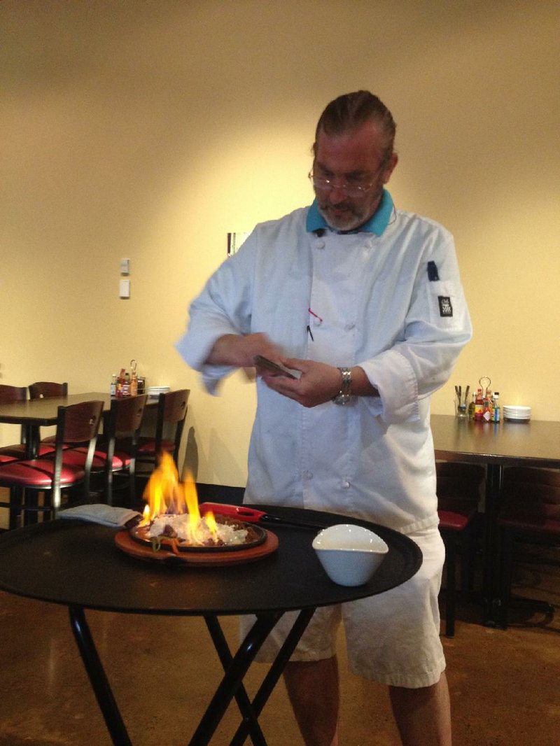 Dinner and a show: Chef Jimmi sets the Fundido appetizer aflame at Ray’s More Than Mex.