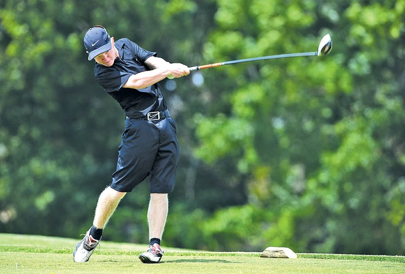  Staff Photo SAMANTHA BAKER @NWASAMANTHA Cody Casebeer of Siloam Springs tees off on the 18th fairway Wednesday at the Springdale Country Club during the Springdale Bulldog Invitational.