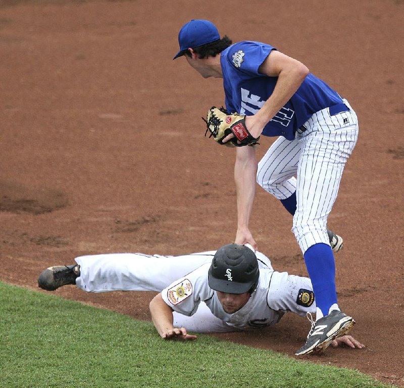  Arkansas Democrat-Gazette/STATON BREIDENTHAL --8/7/14-- Bryant's Trevor Ezell (bottom) is tagged out by New Orleans pitcher Jack Burk after getting caught in a rundown Thursday during the American Legion Mid-South Regional at Burns Park in North Little Rock