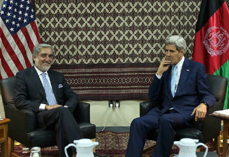 U.S. Secretary of State John Kerry, right, listens to Afghanistan's Presidential candidate Abdullah Abdullah, during a meeting at U.S. embassy in Kabul, Afghanistan, Thursday, Aug. 7, 2014. (AP Photo/Massoud Hossaini, Pool)