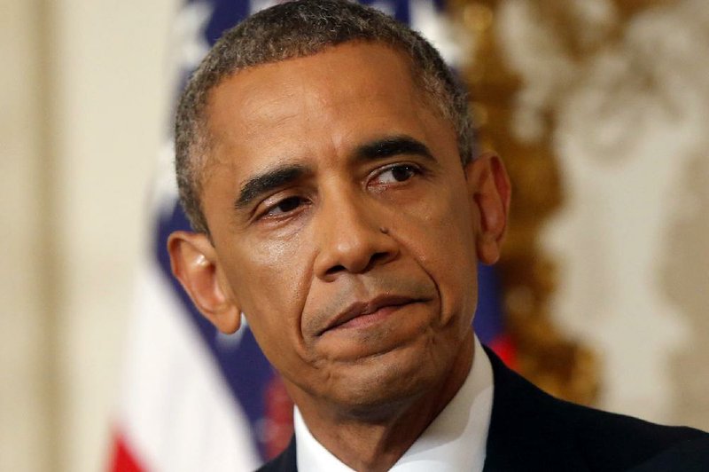 President Barack Obama turns to leave the podium after he spoke about the situation in Iraq in the State Dining Room at the White House in Washington, Thursday, Aug. 7, 2014. Obama says he's authorized the U.S. military to carry out airstrikes in Iraq against Islamic militants if they advance toward the city of Erbil.(AP Photo/Charles Dharapak)