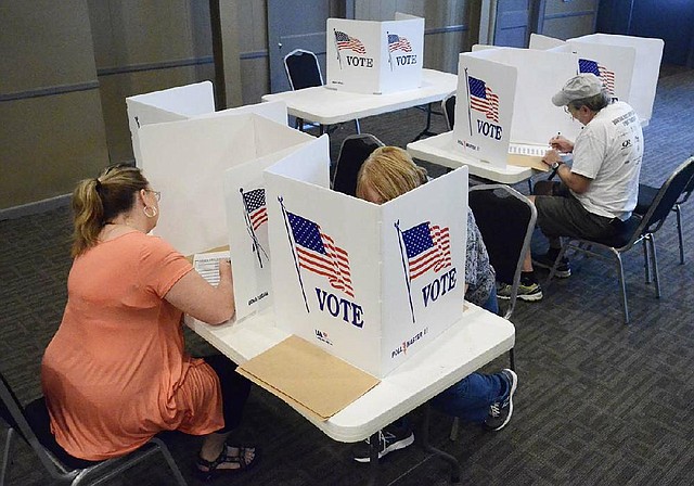 Voters mark their ballots Thursday, Aug. 7, 2014, at the St. Mark's United Methodist Church in Chattanooga, Tenn. Republican voters going to the polls Thursday will determine whether to nominate Lamar Alexander, a 40-year veteran of Tennessee politics, to a third term in the U.S. Senate. (AP Photo/Chattanooga Times Free Press,John Rawlston) THE DAILY CITIZEN OUT; NOOGA.COM OUT; CLEVELAND DAILY BANNER OUT; LOCAL INTERNET OUT