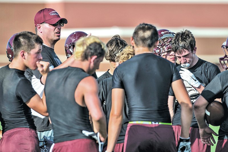  STAFF PHOTO ANTHONY REYES Scott Davenport, Lincoln head football coach, talks to his team July 7 during a 7-on-7 scrimmage at Springdale Har-Ber High in Springdale.