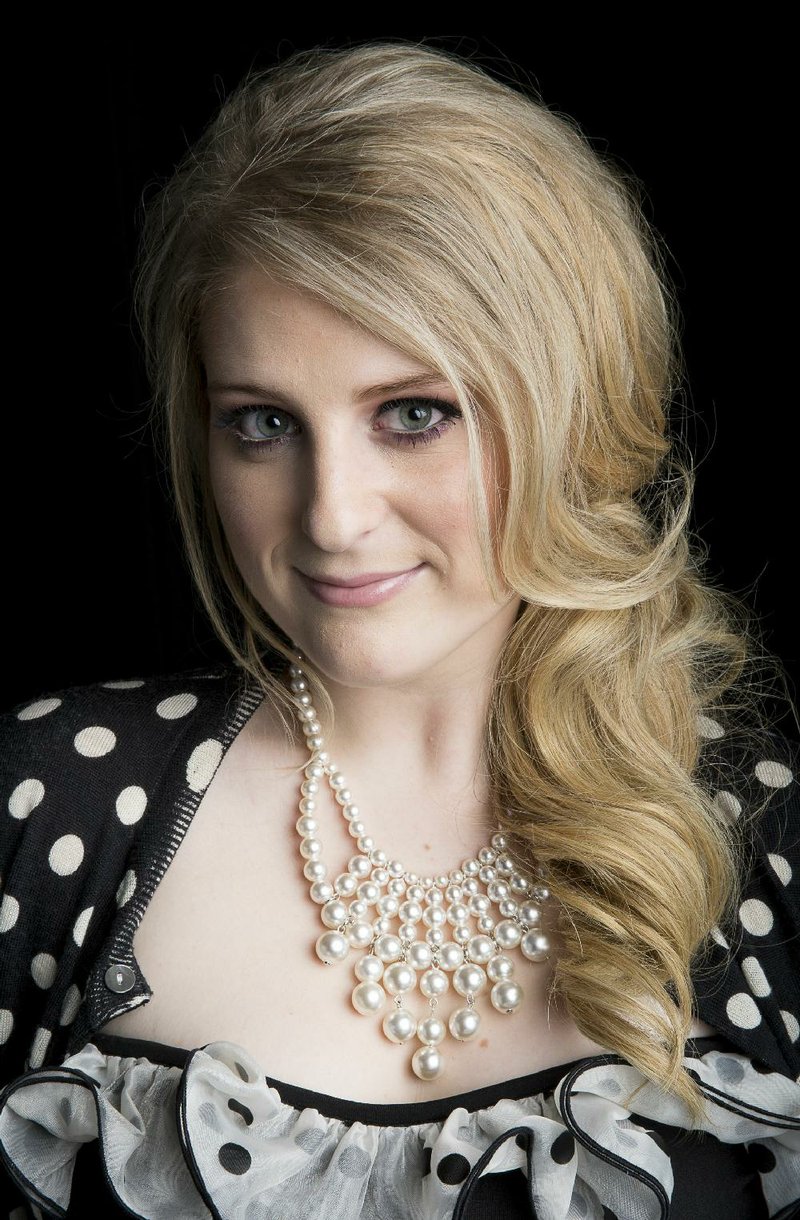 American singer-songwriter Meghan Trainor, known for the pop single "All About That Bass," poses for a portrait, on Thursday, Aug. 7, 2014 in New York. (Photo by Amy Sussman/Invision/AP)