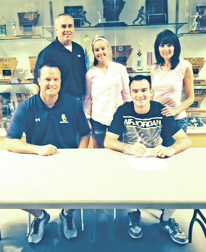 Courtesy Photo Former Shiloh Christian boys basketball standout Andrew Daniels, right, signed a letter of intent to play basketball at South Georgia State College. Daniels was joined in his signing by Shiloh Christian coach Brent Hester, seated left. In back from left, his father Jeff Daniels. sister Makenzie Daniels and mother Robbie Daniels.