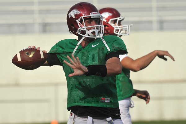 Arkansas quarterback Brandon Allen runs drills Saturday, Aug. 9, 2014, at Razorback Stadium in Fayetteville.