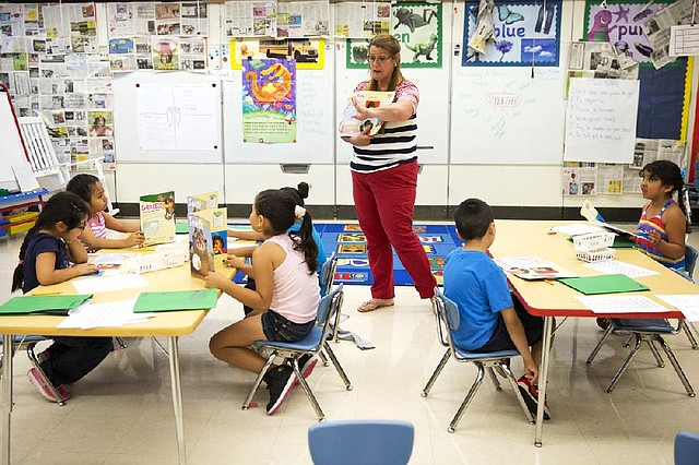 Teacher Jane Cornell works with students on their storytelling skills last month at Mary D. Lang Kindergarten Center in Kennett Square, Pa.