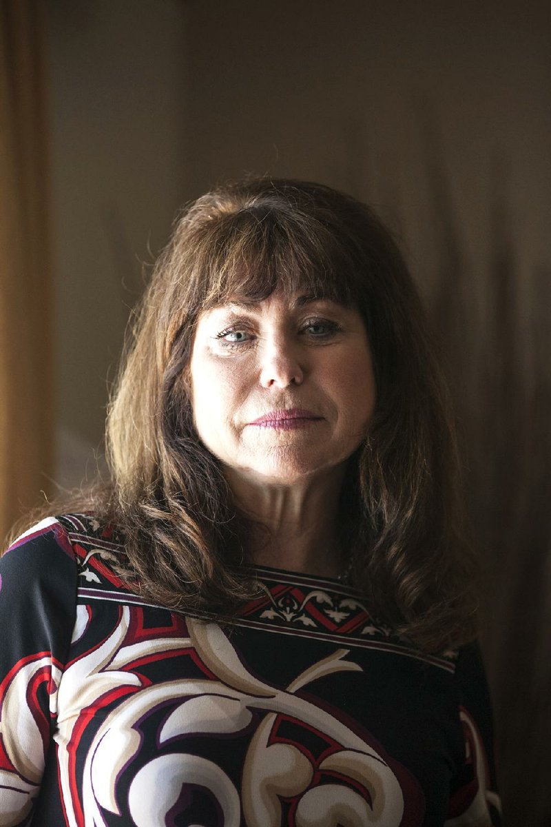 Paula Pedene seen July 27, 2014 at her home in Scottsdale, Ariz., used to be chief spokesperson for the Phoenix Veterans Affairs hospital. After she complained about management, she was moved to a receptionist's job at the hospital's library, which is in the building's basement. Illustrates BASEMENT (category a), by David A. Fahrenthold (c) 2014, The Washington Post. Moved Sunday, Aug. 4, 2014.  (MUST CREDIT: Photo by Samantha Sais for The Washington Post)