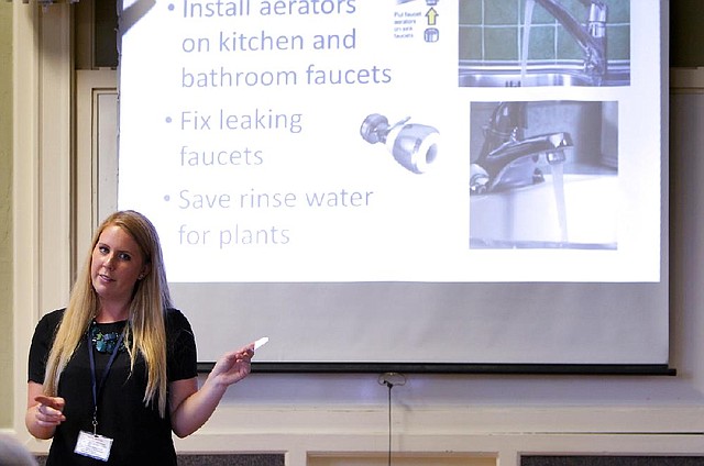 Amanda Bunte, a representative with the city of Santa Cruz, Calif., goes over water conservation tips during Water School at the Louden Nelson Community Center last month.