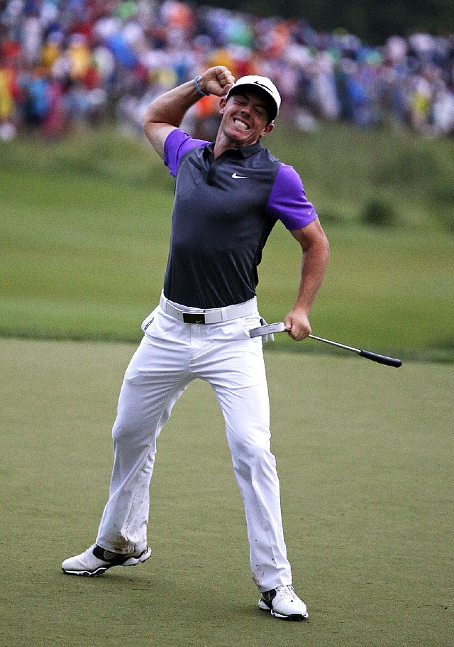Rory McIlroy, of Northern Ireland, celebrates after winning the PGA Championship golf tournament at Valhalla Golf Club on Sunday, Aug. 10, 2014, in Louisville, Ky. (AP Photo/John Locher)