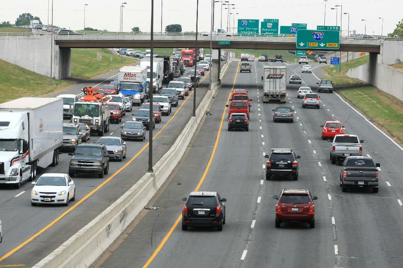 Traffic slows (left) on I-30 eastbound near W. 9th St. in Little Rock in this 2014 file photo.
