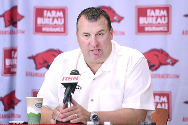 Arkansas head football coach Bret Bielema answers questions from the media Sunday, Aug. 10, 2014, at Fred Smith Football Center in Fayetteville.