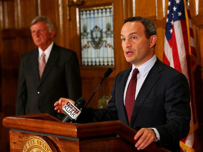 8/11/14
Arkansas Democrat-Gazette/STEPHEN B. THORNTON
Gov Mike Beebe, left, listens as Evan Marwell, CEO of EducationSuperHighway, discusses his partnership with the state of Arkansas to help bring high-speed fiber internet service to Arkansas schools during a press conference Monday at the State Capitol.