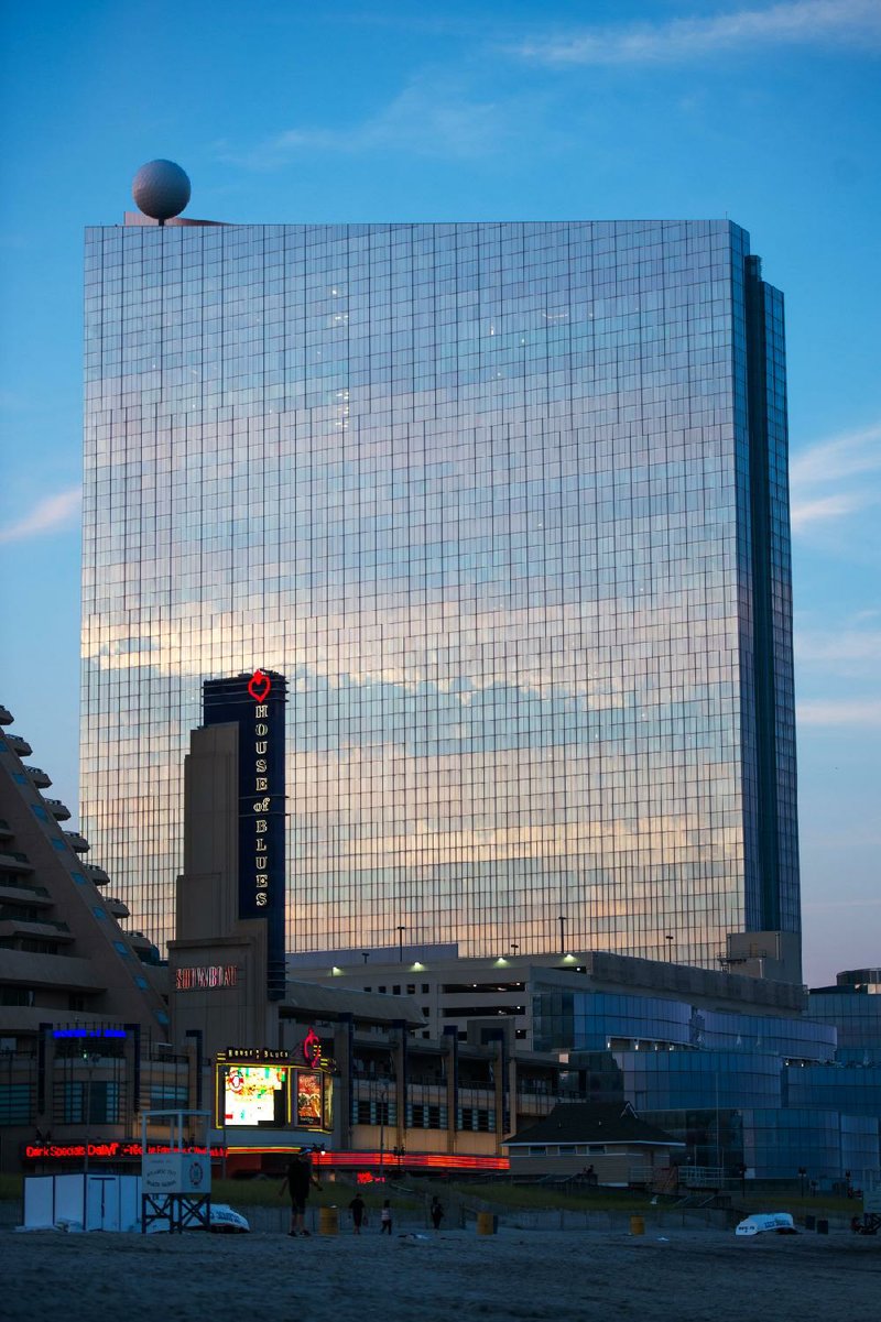 The Revel Atlantic City looms over the Atlantic City boardwalk last month. The 2-year-old, $2.6 billion casino is closing in September after a failed attempt to find a buyer.