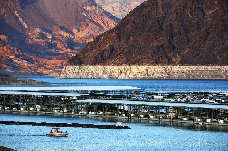 The whitish rock formation on the edge of Lake Mead at Hemenway Harbor shows how far the water has dropped at the Nevada reservoir, its lowest level since it was created in the 1930s.