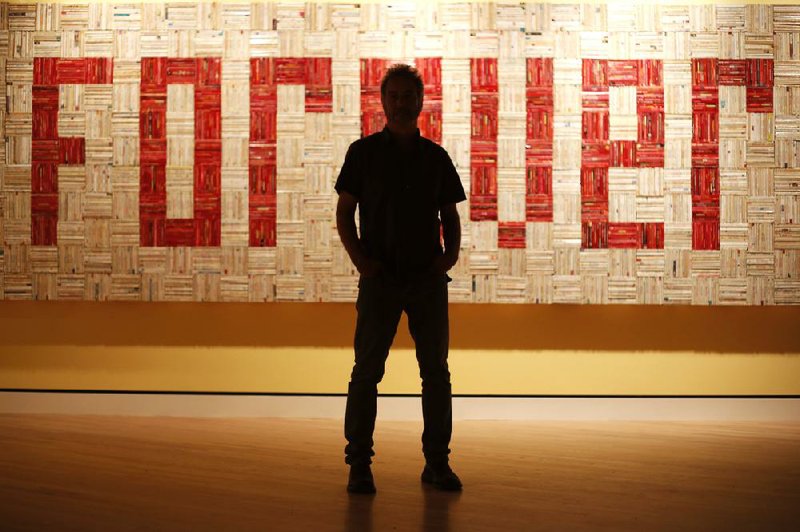 Artist John Salvest stands in front of his work Forever at Crystal Bridges Museum of American Art in Bentonville last week. The piece is one of 227 in “State of the Art: Discovering American Art Now,” which opens Sept. 13 and runs through Jan. 19.