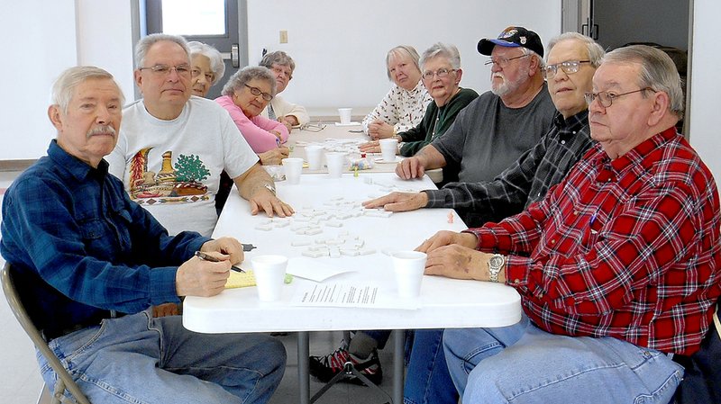 TIMES photograph by Annette Beard Members of the 55 and Over Club meet in the community room at the Emergency Services Building.