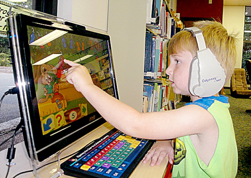 Courtesy of Diane S. Hine Lawson Rich, 4, spends time on one of the children&#8217;s computers at the Bella Vista Public Library recently. With its easy touch-screen controls, kids of all ages can enjoy games, drawing and a wide variety of learning activities.