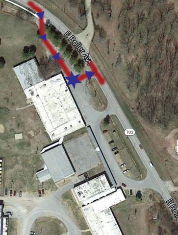 Image from Google Map The new drop-off/pick-up route for Decatur Middle School is indicated by the red line. Traffic going eastbound on Roller Ave. will turn at the first driveway on the north end of the middle school (as indicated by the arrow). The drop point will be along the covered walkway (as indicated by the star). Traffic will exit onto Roller Ave. at the next driveway (indicated by the arrow).