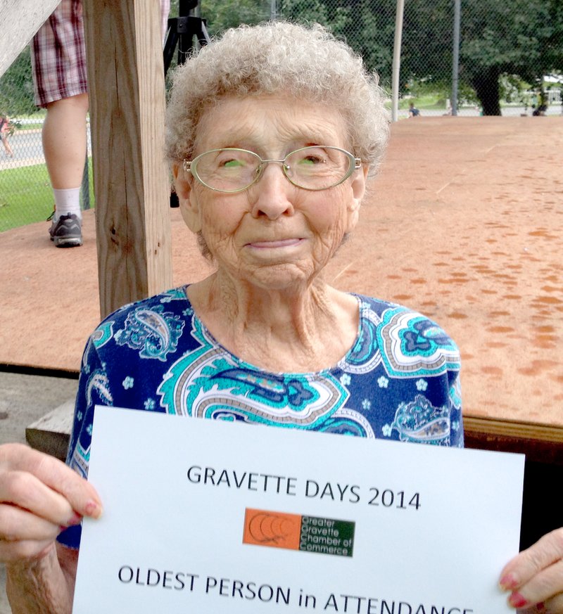 Submitted Photo Katherine Tucker of Gravette, 91, won the certificate Saturday for being the oldest person in attendance at Gravette Days festivities in Kindley Park. Tucker also writes Maysville news for the Westside Eagle Observer. Rain prevented finding the youngest in attendance.