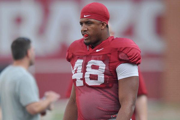 Arkansas defensive end Deatrich Wise gets ready to run drills Saturday, Aug. 9, 2014, at Razorback Stadium in Fayetteville.