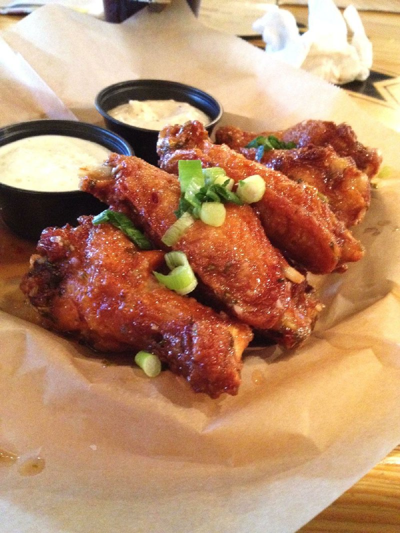 The Thai Chili Style Wings come with ranch and jalapeno aioli dips at Arkansas Ale House.