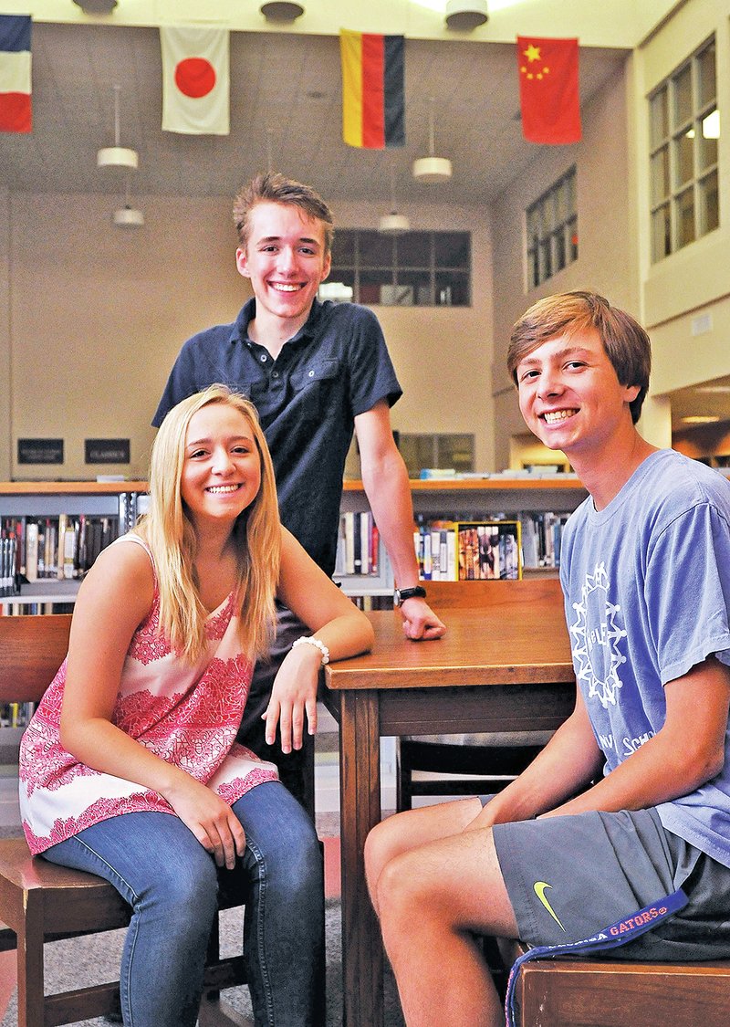 STAFF PHOTO BEN GOFF &#8226; @NWABenGoff Allison Goldberg, 17, from left, Derek Norby, 16, and Keagan Chronister, 17, recently returned from a two-week trip to China. The Bentonville High School student went with 700 other U.S. students in the Confucius Institute&#8217;s Summer Bridge Program.